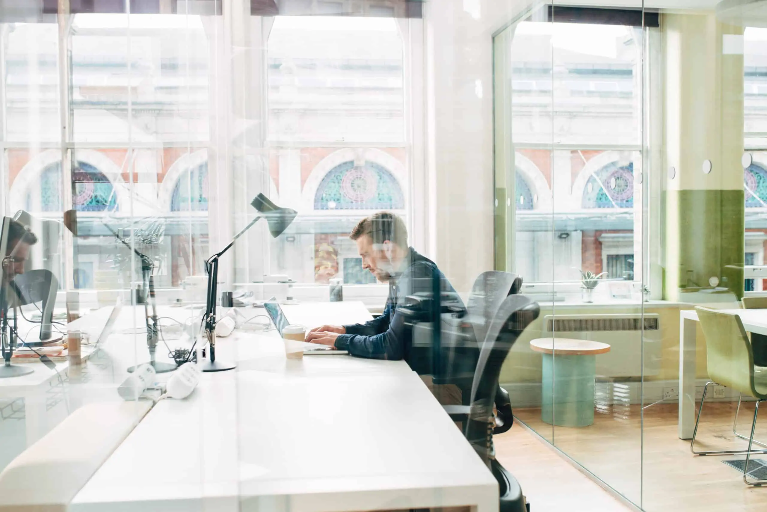 Businessman using laptop at work for internet research